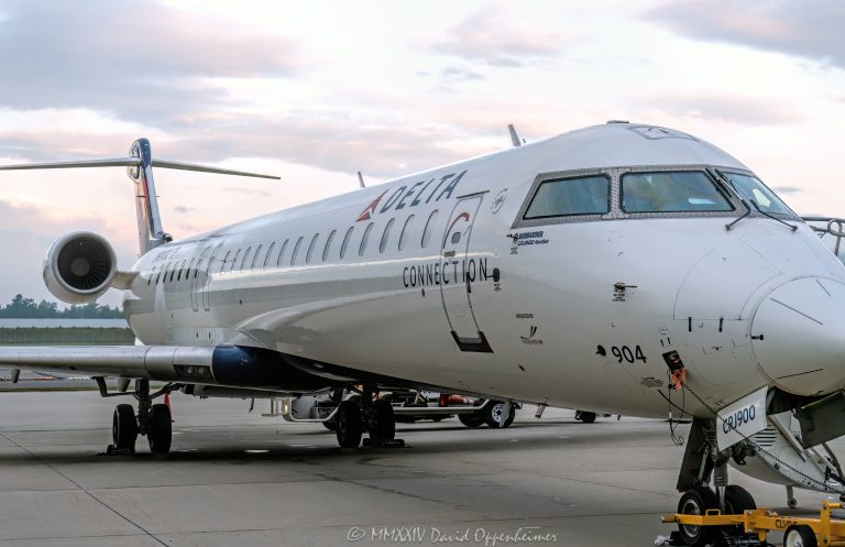 Bombardier CRJ900, Bombardier, CRJ900, Delta, Delta Air Lines, Delta Connection, commuter jet, commuter, airplane, plane, N904XJ, Asheville Regional Airport, AVL, KAVL, airport, Asheville Airport, Fletcher, aircraft, fly, flight, travel, air travel, Buncombe County, North Carolina, WNC, vacation, tourism, influx, visit, explore, regional jet, regional, sky, field, ready for takeoff, United States, horizontal, color, 1-13439195601,