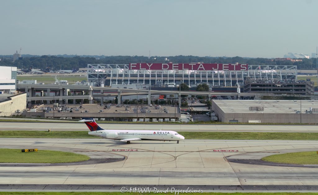 Delta Air Lines, Delta, Boeing 717, Boeing, N939AT, jet, taxiing, aircraft, airplane, plane, airport, Atlanta Airport, fly, fight, travel, air travel, airline, aviation, commercial jet, DAL, DAL stock, Hartsfield-Jackson Atlanta International Airport, Atlanta, ATL, KATL, BA, BA stock, runway, Georgia, aerial, aerial view, aerial photography, aerial photographer, David Oppenheimer, color, horizontal, United States, 1-13439195601,