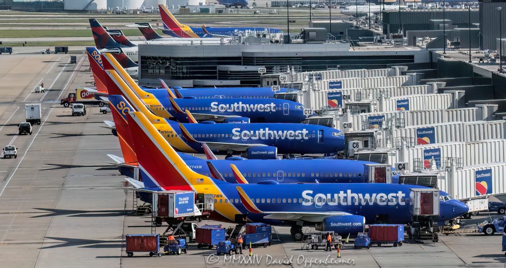 Southwest Airlines, Southwest Airlines jets, LUV stock, Southwest, airport, planes, airplanes, passenger, tarmac, parked, jets, planes, terminal, Atlanta Airport, ATL, Hartsfield–Jackson Atlanta International Airport, Georgia, travel, aircraft, aviation, aerial, aerial view, aerial photography, aerial photographer, travel, transportation, air travel, flight, horizontal, color, United States, 1-13439195601,