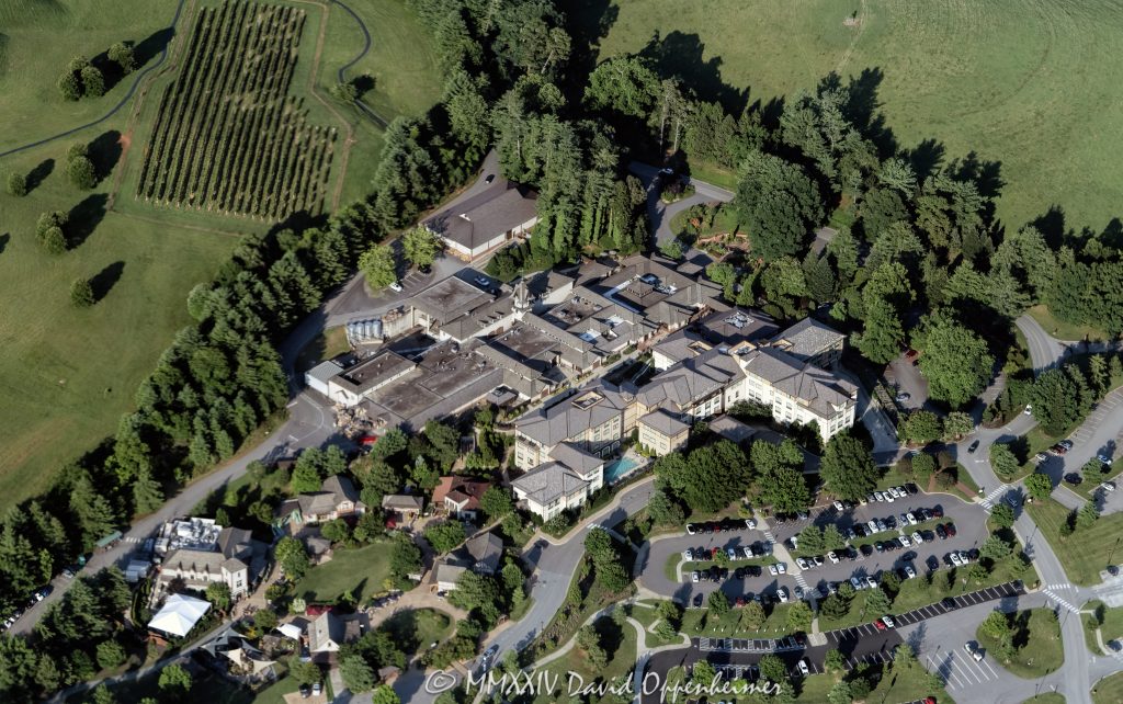 Antler Hill Village with the Village Hotel and Biltmore Estate Winery at the Biltmore Estate in Asheville, North Carolina aerial view - © 2024 David Oppenheimer - Performance Impressions aerial photography archives - https://performanceimpress ions.com Village Hotel on Biltmore Estate, Village Hotel, hotel, Biltmore Estate Winery, winery, aerial, Antler Hill Village, Antler Hill, Biltmore Estate, Biltmore House, Biltmore, Biltmore House aerial, Asheville, Biltmore aerial, Biltmore Estate aerial, Buncombe County, North Carolina, aerial, Asheville aerial, WNC, AVL, city, City of Asheville, George Washington Vanderbilt II, George Vanderbilt, photo, photography, United States, horizontal, color, David Oppenheimer, David Gordon Oppenheimer, Bistro, parking lot, parking, 1-13726821381