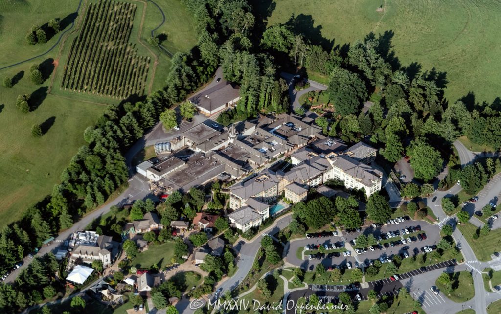 Antler Hill Village with the Village Hotel and Biltmore Estate Winery at the Biltmore Estate in Asheville, North Carolina aerial view - © 2024 David Oppenheimer - Performance Impressions aerial photography archives - https://performanceimpress ions.com Village Hotel on Biltmore Estate, Village Hotel, hotel, Biltmore Estate Winery, winery, aerial, Antler Hill Village, Antler Hill, Biltmore Estate, Biltmore House, Biltmore, Biltmore House aerial, Asheville, Biltmore aerial, Biltmore Estate aerial, Buncombe County, North Carolina, aerial, Asheville aerial, WNC, AVL, city, City of Asheville, George Washington Vanderbilt II, George Vanderbilt, photo, photography, United States, horizontal, color, David Oppenheimer, David Gordon Oppenheimer, Bistro, parking lot, parking, 1-13726821381