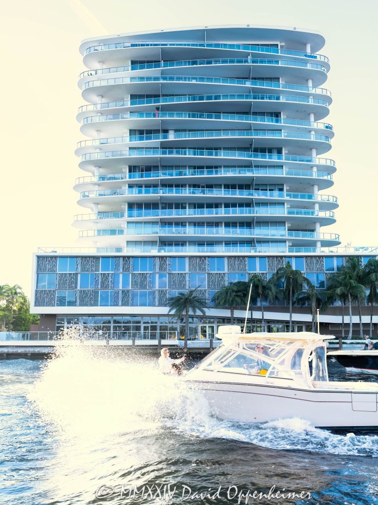AquaBlu waterfront condos at 920 Intracoastal Dr in Fort Lauderdale Historic District in Florida - © 2024 David Oppenheimer - Performance Impressions photography archives - https://performanceimpressions.com AquaBlu, AquaBlu condos, 920 Intracoastal Dr, Historic District, boat, boating, yachting, splash, waves, water, condo building, building, condos, apartments, Fort Lauderdale, Florida, facade, waterfront, luxury real estate, real estate, Fort Lauderdale real estate, dock, dockage, home, Intracoastal, Intracoastal Waterway, gated community, community, private community, private, prestigious, balcony, balconies, windows, luxury rental, rental, 33304, South Florida, Broward County, neighborhood, security, Ocean Land Investments, apartment building, contemporary, modern, exclusive, property, peninsula, luxury condos, smart home, resort-style, outdoor living, New River, East Fort Lauderdale, architecture, sunset, palm trees, seawall, tropical, David Oppenheimer, color, vertical, United States, VAu 1-530-124, 1-13553735171,