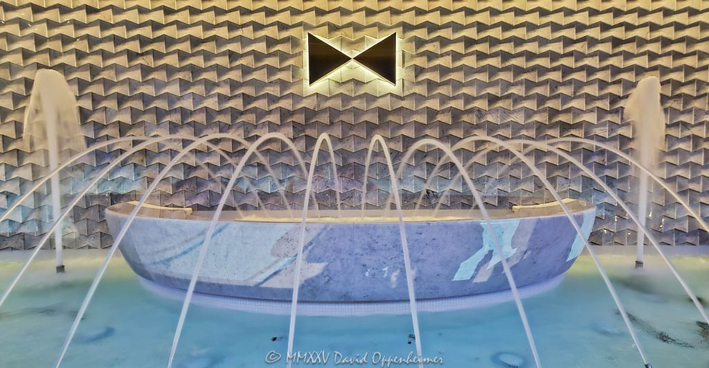 Water fountain at the Fontainebleau Las Vegas entrance in Las Vegas, Nevada - © 2025 David Oppenheimer - Performance Impressions travel photography archives - https://performanceimpressions.com fountain, water fountain, Fontainebleau Las Vegas, Fontainebleau, Fontainebleau Las Vegas fountain, water, waterfall, marble, sculpture, lighting, bowtie, logo, design, lights, crystal, crystal chandelier, Morris Lapidus, resort, casino, Vegas, art deco, Fontainebleau Development, Jeffrey Soffer, Carlos Zapata Studio, Bowtie Hospitality, bowtie, hospitality, Maurice Wooden, Koch Real Estate Investments, Las Vegas, money, gaming, play, Nevada, odds, win, gambling, wager, bet, luck, gamble, resort, 2777 South Las Vegas Boulevard, 89109, United States, horizontal, color, 1-14977862771