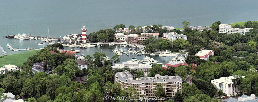 Harbour Town Lighthouse at 149 Lighthouse Road on Hilton Head Island, South Carolina, aerial view © 2024 David Oppenheimer - Performance Impressions aerial photography archives - https://performanceimpressions.com Harbour Town Lighthouse, Harbour Town Lighthouse aerial, lighthouse, Harbour Town, Liberty Oak, Liberty Oak park, park, marina, lighthouse, museum, history, Harbour Town aerial, Harbour Town aerial view, Harbour Town Marina, Harbour Town Marina aerial, Pirates of Hilton Head, Harbour Town Pier, pier, Harbour Town Yacht Basin, 149 Lighthouse Road, Haig Point Water Taxi, docks, water taxi, memorial park, coast, Harbour Town Yacht Club, harbor, yachts, boats, yacht club, Schooner Court Villas, Caravel Court Villas, Ketch Court Villas, Clipper Court Villas, Marriott's Harbour Club, Marriott's Heritage Club, vacation club, Harbour Town Golf Links, golf, golf course, Vagabond Cruise, sightseeing, shopping, retail, Sea Pines Resort, sea pines, resort, Harbour Town Golf Links, golf, golf course, vacation, Hilton Head, Hilton Head Island, Town of Hilton Head, 29928, South Carolina, Lowcountry, Hilton head island real estate, Hilton Head real estate, real estate, aerial photographer, aerial photography, aerial view, aerial, building, architecture, David Oppenheimer, David Gordon Oppenheimer, United States, color, horizontal, 1-13726821381,