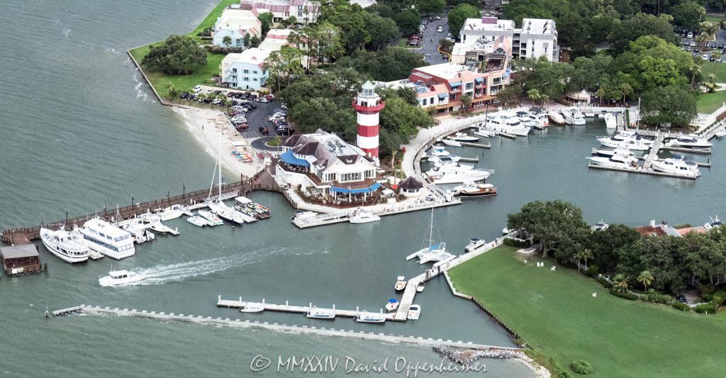 Harbour Town Lighthouse at 149 Lighthouse Road on Hilton Head Island, South Carolina, aerial view © 2024 David Oppenheimer - Performance Impressions aerial photography archives - https://performanceimpressions.com Harbour Town Lighthouse, Harbour Town Lighthouse aerial, lighthouse, Harbour Town, Liberty Oak, Liberty Oak park, park, marina, Harbour Town Marina, Harbour Town Marina aerial, lighthouse, museum, history, Harbour Town aerial, Harbour Town aerial view, Pirates of Hilton Head, Harbour Town Pier, pier, 149 Lighthouse Road, Haig Point Water Taxi, docks, water taxi, memorial park, coast, Harbour Town Yacht Basin, Harbour Town Yacht Club, harbor, yachts, boats, yacht club, Schooner Court Villas, Harbour Town Golf Links, golf, golf course, Vagabond Cruise, sightseeing, shopping, retail, Sea Pines Resort, sea pines, resort, Harbour Town Golf Links, golf, golf course, vacation, Hilton Head, Hilton Head Island, Town of Hilton Head, 29928, South Carolina, Lowcountry, Hilton head island real estate, Hilton Head real estate, real estate, aerial photographer, aerial photography, aerial view, aerial, building, architecture, David Oppenheimer, David Gordon Oppenheimer, United States, color, horizontal, 1-13726821381,