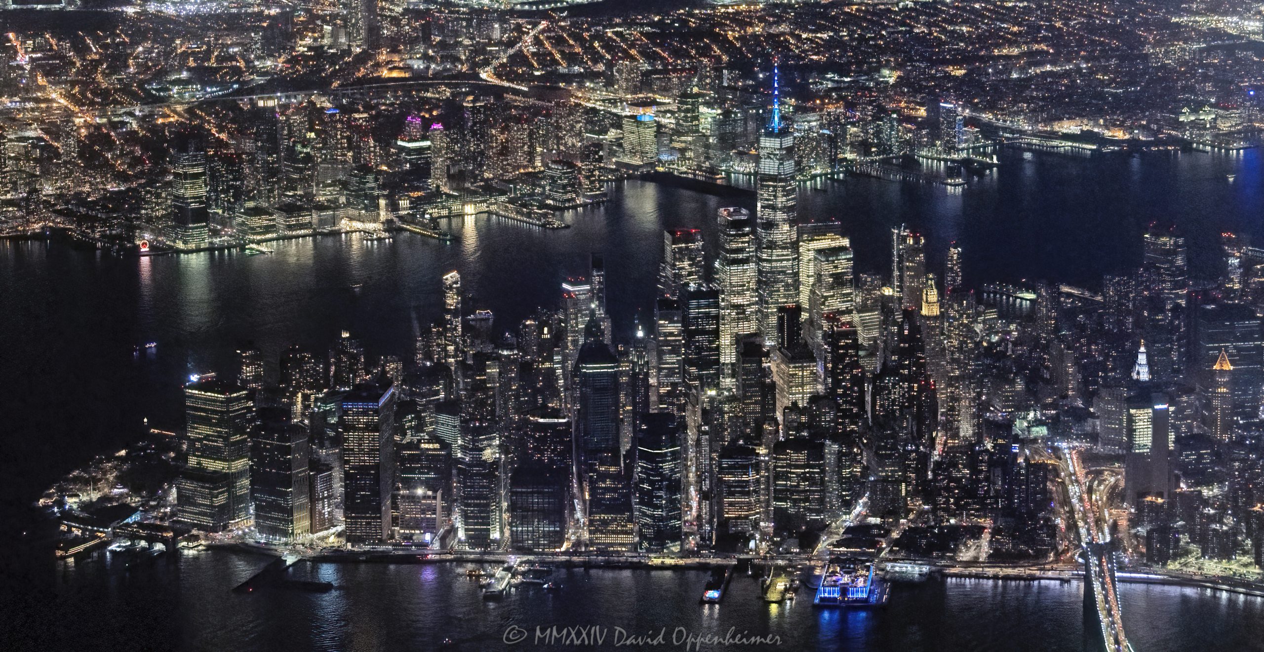 Lower Manhattan and the Financial District skyline in New York City at night aerial view - © 2024 David Oppenheimer - Performance Impressions aerial photography archives - https://performanceimpressions.com Lower Manhattan, Manhattan, Downtown Manhattan, Downtown New York City, Downtown NYC, Downtown, New York Harbor, SOHO, Tribeca, Financial District, Seaport, Two Bridges, Lower East Side, Manhattan aerial, East River, Hudson River, NYC aerial, One World Trade Center, 1 WTC, Jersey City, Civic Center, NYC Financial District, skyscrapers, skyline, landscape, cityscape, Hilton Garden Inn NYC Financial Center, Financial Center, finance, financial center, 2 American Express Plz, American Express Plz, 55 Water Street, 32 Old Slip, Old Slip Plaza, 111 Wall Street, Wall Street, Brooklyn Bridge, Pier 17, FDR Drive, 120 Wall Street, 70 South St, aerial, aerial view, aerial photographer, aerial photography, David Oppenheimer, color, horizontal, United States, 1-13985601741,