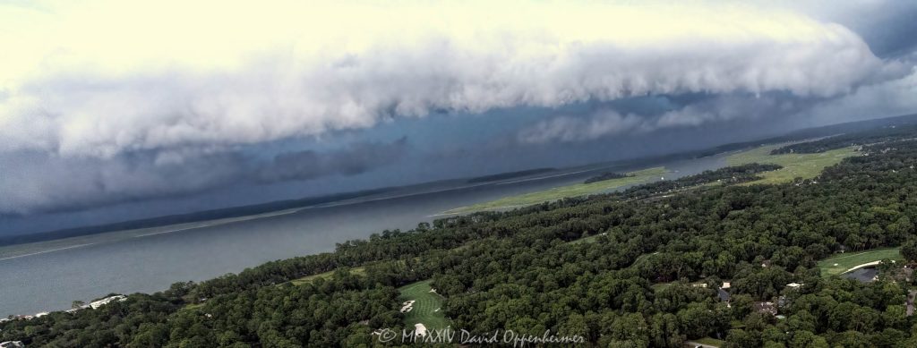 Arcus shelf cloud thunderstorm front squall line over Calibogue Sound by Hilton Head Island, South Carolina aerial view - © 2024 David Oppenheimer - Performance Impressions photography archives - https://performanceimpressions.com shelf cloud, clouds, cloud front, front, storm, wall, thunderstorm, storm front, squall line, arcus, arcus cloud, convection, weather, Hilton Head, Hilton Head Island, Hilton Head aerial, Hilton Head Island aerial, cumulonimbus, air, atmosphere, wind, downdraft, meteorology, Hilton Head storm, Hilton Head Island weather, Hilton Head weather, Hilton Head Island Storm, aviation, flying, turbulence, wind shear, offshore, safety, conditions, helicopter, flight, FAA, NCEP, pilots, FSS, METAR, SPECI, observation, visibility, ceiling, sky, operations, logistics, Calibogue Sound, Buck Island, Broad Creek, Comfort Creek, Lawton, Lawtown Creek, Shark Bank, Bull Island, Daufuskie Island, marsh, marshlands, Long Island, Calibogue Club, Sea Pines, Stoney Creek, Calibogue Club Villas, Sea Loft Villas, Sea Loft, Fairway Oaks Villas, Fairway Oaks, Plantation Club, Plantation Club Villas, Sea Pines Resort, beach, beach access, coast, South Carolina coast, coastal, shoreline, shore, shoreline aerial, waterfront, dunes, sand, beachfront, sand dunes, vacation, vacation homes, beach houses, houses, beach homes, summer, summer homes, residences, properties, Atlantic Ocean, Hilton Head, Hilton Head Island, Town of Hilton Head, South Carolina, coastline, coastline aerial, luxury, Lowcountry, Hilton head island real estate, Hilton Head real estate, real estate, Hilton Head aerial, aerial photographer, aerial photography, photography, aerial view, aerial, 29928, David Oppenheimer, David Gordon Oppenheimer, United States, color, horizontal, 1-13726821381,