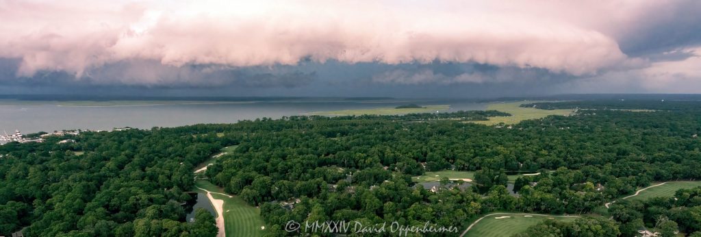 Arcus shelf cloud thunderstorm front squall line over Calibogue Sound by Hilton Head Island, South Carolina aerial view - © 2024 David Oppenheimer - Performance Impressions photography archives - https://performanceimpressions.com shelf cloud, clouds, cloud front, front, storm, wall, thunderstorm, storm front, squall line, arcus, arcus cloud, convection, weather, Hilton Head, Hilton Head Island, Hilton Head aerial, Hilton Head Island aerial, cumulonimbus, air, atmosphere, wind, downdraft, meteorology, Hilton Head storm, Hilton Head Island weather, Hilton Head weather, Hilton Head Island Storm, aviation, flying, turbulence, wind shear, offshore, safety, conditions, helicopter, flight, FAA, NCEP, pilots, FSS, METAR, SPECI, observation, visibility, ceiling, sky, operations, logistics, Calibogue Sound, Buck Island, Broad Creek, Comfort Creek, Lawton, Lawtown Creek, Shark Bank, Bull Island, Daufuskie Island, marsh, marshlands, Long Island, Calibogue Club, Sea Pines, Stoney Creek, Calibogue Club Villas, Sea Loft Villas, Sea Loft, Fairway Oaks Villas, Fairway Oaks, Plantation Club, Plantation Club Villas, Sea Pines Resort, beach, beach access, coast, South Carolina coast, coastal, shoreline, shore, shoreline aerial, waterfront, dunes, sand, beachfront, sand dunes, vacation, vacation homes, beach houses, houses, beach homes, summer, summer homes, residences, properties, Atlantic Ocean, Hilton Head, Hilton Head Island, Town of Hilton Head, South Carolina, coastline, coastline aerial, luxury, Lowcountry, Hilton head island real estate, Hilton Head real estate, real estate, Hilton Head aerial, Harbour Town Lighthouse, Harbour Town, aerial photographer, aerial photography, photography, aerial view, aerial, 29928, David Oppenheimer, David Gordon Oppenheimer, United States, color, horizontal, 1-13726821381,