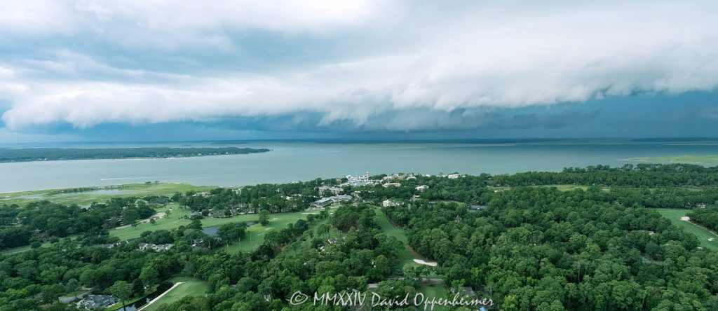 Arcus shelf cloud thunderstorm front squall line over Calibogue Sound by Hilton Head Island, South Carolina aerial view - © 2024 David Oppenheimer - Performance Impressions photography archives - https://performanceimpressions.com shelf cloud, clouds, cloud front, front, storm, wall, thunderstorm, storm front, squall line, arcus, arcus cloud, convection, weather, Hilton Head, Hilton Head Island, Hilton Head aerial, Hilton Head Island aerial, cumulonimbus, air, atmosphere, wind, downdraft, meteorology, Hilton Head storm, Hilton Head Island weather, Hilton Head weather, Hilton Head Island Storm, aviation, flying, turbulence, wind shear, offshore, safety, conditions, helicopter, flight, FAA, NCEP, pilots, FSS, METAR, SPECI, observation, visibility, ceiling, sky, operations, logistics, Calibogue Sound, Buck Island, Broad Creek, Comfort Creek, Lawton, Lawtown Creek, Shark Bank, Bull Island, Daufuskie Island, marsh, marshlands, Long Island, Calibogue Club, Sea Pines, Stoney Creek, Calibogue Club Villas, Sea Loft Villas, Sea Loft, Fairway Oaks Villas, Fairway Oaks, Plantation Club, Plantation Club Villas, Sea Pines Resort, beach, beach access, coast, South Carolina coast, coastal, shoreline, shore, shoreline aerial, waterfront, dunes, sand, beachfront, sand dunes, vacation, vacation homes, beach houses, houses, beach homes, summer, summer homes, residences, properties, Atlantic Ocean, Hilton Head, Hilton Head Island, Town of Hilton Head, South Carolina, coastline, coastline aerial, luxury, Lowcountry, Hilton head island real estate, Hilton Head real estate, real estate, Hilton Head aerial, Harbour Town Lighthouse, Harbour Town, aerial photographer, aerial photography, photography, aerial view, aerial, 29928, David Oppenheimer, David Gordon Oppenheimer, United States, color, horizontal, 1-13726821381,