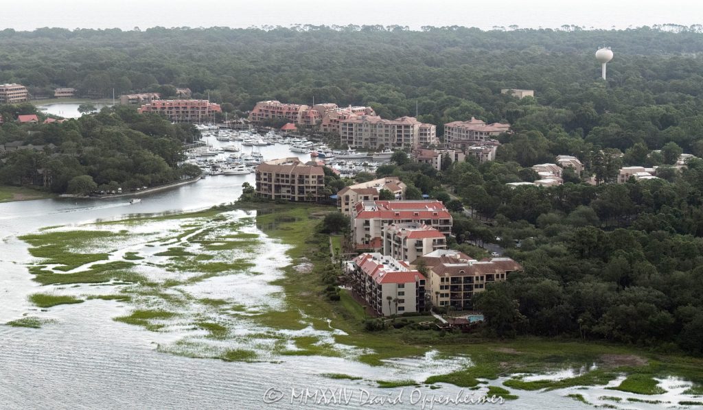 Shelter Cove Harbour & Marina at 1 Shelter Cove Ln on Hilton Head Island, South Carolina aerial view - © 2024 David Oppenheimer - Performance Impressions photography archives - https://performanceimpressions.com Shelter Cove Harbour & Marina, Shelter Cove Harbour & Marina aerial, Shelter Cove, harbor, marina, resort, marsh, marshlands, waterfront, bay, 1 Shelter Cove Ln, boating, yachts, Palmetto Dunes Resort, ocean resort, ocean, Shelter Cove Marina, docking, docks, Palmetto Dunes, Palmetto Dunes Oceanfront Resort, oceanfront, Hilton Head, Hilton Head Island, Hilton Head aerial, Hilton Head Island aerial, Broad Creek, Calibogue Sound, beach, coast, South Carolina coast, coastal, shoreline, shore, aerial, waterfront, dunes, beachfront, estuary, vacation, vacation homes, beach houses, tidal, creek, houses, beach homes, summer, summer homes, residences, properties, Atlantic Ocean, Town of Hilton Head, South Carolina, coastline, coastline aerial, luxury, Lowcountry, Hilton head island real estate, Hilton Head real estate, real estate, Hilton Head aerial, aerial photographer, aerial photography, photography, aerial view, aerial, 29928, David Oppenheimer, David Gordon Oppenheimer, United States, color, horizontal, 1-13726821381,