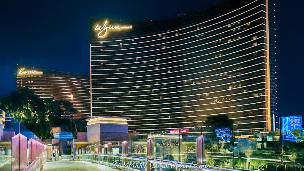 Wynn and Encore Las Vegas resort and casino lights at night in Las Vegas, Nevada - © 2025 David Oppenheimer - Performance Impressions photography archives - https://performanceimpressions.com Wynn, Encore, Encore Las Vegas, Encore Resort, Encore Casino, Encore Vegas, Encore at Wynn, Wynn Las Vegas, Wynn Vegas, Wynn Resort, Wynn Casino, Wynn Resorts, 3131 Las Vegas Blvd S, 89109, hotel, casino, resort, building, architecture, shops, shopping, bridge, night, lights, city lights, WYNN, WYNN stock, five star, luxury, Louis Vuitton, CHANEL, Dior, Cartier, Fashion Show Mall Bridge to Wynn, Fashion Show Mall Bridge, Las Vegas, Vegas, Las Vegas at night, Las Vegas city lights, Las Vegas Strip, Las Vegas Strip architecture, Las Vegas night photography, night photo, nighttime, cityscape, urban photography, mall, Fashion Show, vacation, escape, dream, art, fine art, artwork, painting, resort architecture, casino lights, neon lights, modern architecture, urban, casinos, facade, urban design, design, skyline, Nevada, Nevada photography, colorful, United States, horizontal, color, 1-14977862771