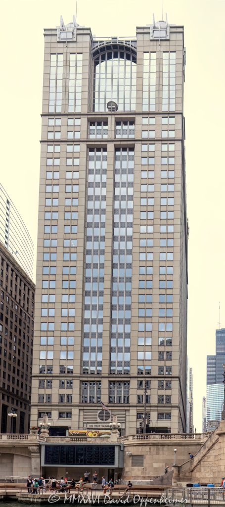 225 West Wacker Drive office tower in downtown Chicago, Illinois, located along the Chicago River in the Loop business district. Postmodern commercial high-rise architecture designed by Kohn Pedersen Fox featuring granite exterior detailing, reflective glass facade design, and prominent riverfront positioning near the Chicago Riverwalk within Chicago’s financial district. - © 2026 David Oppenheimer - Performance Impressions photography archives https://performanceimpressions.com 225 West Wacker, 225 West Wacker Drive, 225 W Wacker, West Wacker Drive, Wacker Drive, Chicago, Chicago Illinois, Illinois, United States, 60606, Downtown Chicago, Chicago Loop, Chicago River, Chicago riverfront, Chicago Riverwalk, architecture, Chicago architecture, architectural photography, urban architecture, postmodern architecture, modern architecture, contemporary architecture, postmodern skyscraper, skyscraper, high-rise, office tower, building, tower, office building, commercial building, corporate tower, corporate headquarters, commercial real estate, corporate real estate, real estate, business district, financial district, commercial architecture, corporate architecture, downtown, urban, riverfront architecture, riverfront tower, riverfront office building, granite facade, granite exterior, glass tower, glass building, glass facade, reflective glass, curtain wall, facade, building exterior, reflections, iconic building, American architecture, Illinois architecture, exterior, daylight, waterfront, financial center, business center, Class A office building, Chicago skyscraper, Chicago office tower, downtown office tower, commercial tower, office architecture, Loop district, Kohn Pedersen Fox, Kohn Pedersen Fox Associates, KPF, commercial photography, commercial imagery, image licensing, licensing, photography licensing, David Oppenheimer, 1-15156784411