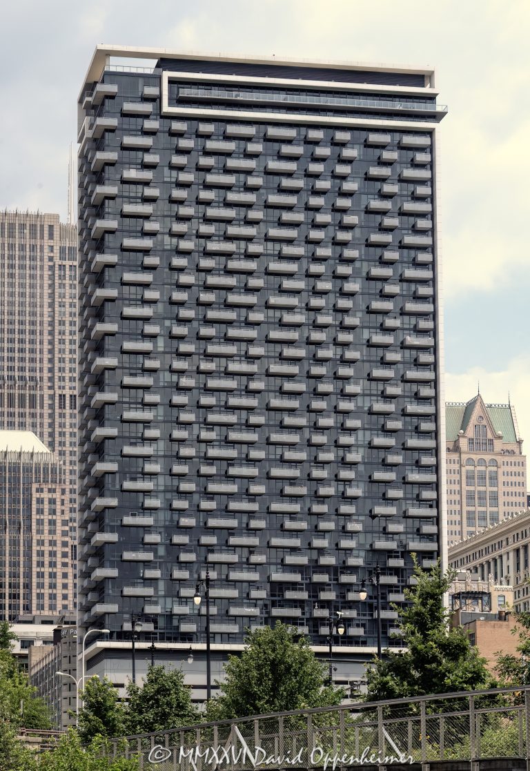 235 West Van Buren condominium tower in downtown Chicago, Illinois, located in the Loop near the Chicago River and Willis Tower. Contemporary residential high-rise architecture designed by Perkins and Will featuring dark glass facade design, exposed concrete framing, and balconies that create a distinctive grid-like exterior. The 46-story condominium building was developed by CMK Companies and completed in 2010. - © 2026 David Oppenheimer - Performance Impressions photography archives https://performanceimpressions.com 235 Van Buren, 235 West Van Buren, 235 West Van Buren Street, 235 W Van Buren, West Van Buren Street, Van Buren Street, 235 W Van Buren Condominiums, 235 West Van Buren Condominiums, Chicago, Chicago Illinois, Illinois, United States, 60607, Downtown Chicago, Chicago Loop, South Loop, Chicago River, Willis Tower, architecture, Chicago architecture, architectural photography, urban architecture, modern architecture, contemporary architecture, residential architecture, condominium tower, condominium building, condo tower, condo building, residential tower, residential building, high-rise, skyscraper, building, tower, glass tower, dark glass, glass facade, curtain wall, facade, balconies, balcony, concrete frame, exposed concrete, grid facade, building exterior, reflections, iconic building, American architecture, Illinois architecture, exterior, daylight, downtown, urban, real estate, residential real estate, condominium real estate, Chicago real estate, luxury condos, urban living, city living, mixed-use building, retail space, South Loop architecture, Chicago condominium, Chicago condos, downtown condos, Perkins and Will, Perkins+Will, CMK Companies, CMK Development, Lendlease, Bovis Lend Lease, commercial photography, commercial imagery, image licensing, licensing, photography licensing, fine art, David Oppenheimer, 1-15156784411
