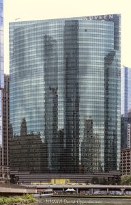 333 Wacker Drive on the Chicago River 333 Wacker Drive curves along the Chicago River in the Loop, with its blue-green glass facade reflecting the riverfront and Chicago Riverwalk below. Designed by Kohn Pedersen Fox, the postmodern office tower is a widely recognized Wacker Drive skyscraper and a Chicago address associated with Nuveen – © 2026 David Oppenheimer – Performance Impressions photography archives https://performanceimpressions.com 333 Wacker Drive, 333 West Wacker Drive, 333 W Wacker Drive, 333 W Wacker Dr, 333 West Wacker, 333 W Wacker, 333 Wacker, 333 Wacker Drive Chicago, 333 West Wacker Chicago, Nuveen 333 Wacker Drive, Nuveen Chicago, Nuveen Investments, Nuveen Asset Management, Nuveen LLC, TIAA, TIAA company, Chicago Loop, Loop Chicago, downtown Chicago, Chicago Illinois, Chicago IL, West Wacker Drive, Wacker Drive, Chicago River, Chicago Riverwalk, Riverwalk Chicago, Chicago riverfront, riverfront, Loop riverfront, Franklin Street, Lake Street, 60606, facade, building exterior, exterior, glass facade, curved glass facade, blue green glass, green glass facade, reflective glass, glass reflection, reflection, river reflection, Chicago River reflection, mirrored facade, office tower, office building, commercial building, Class A office building, skyscraper, high rise, tower, architecture, architectural photography, Chicago architecture, downtown Chicago architecture, riverfront architecture, postmodern architecture, contextual architecture, commercial architecture, Kohn Pedersen Fox, KPF, Kohn Pedersen Fox Associates, William Pedersen, HKS, Hines, Beacon Capital Partners, Nuveen sign, corporate tenant, asset management, investment management, financial services, Ferris Bueller building, Chicago skyline, Illinois architecture, United States, Licensing, image licensing, commercial imagery, photography licensing, art, print, fine art, commercial photography, David Oppenheimer, vertical, 1-15156784411