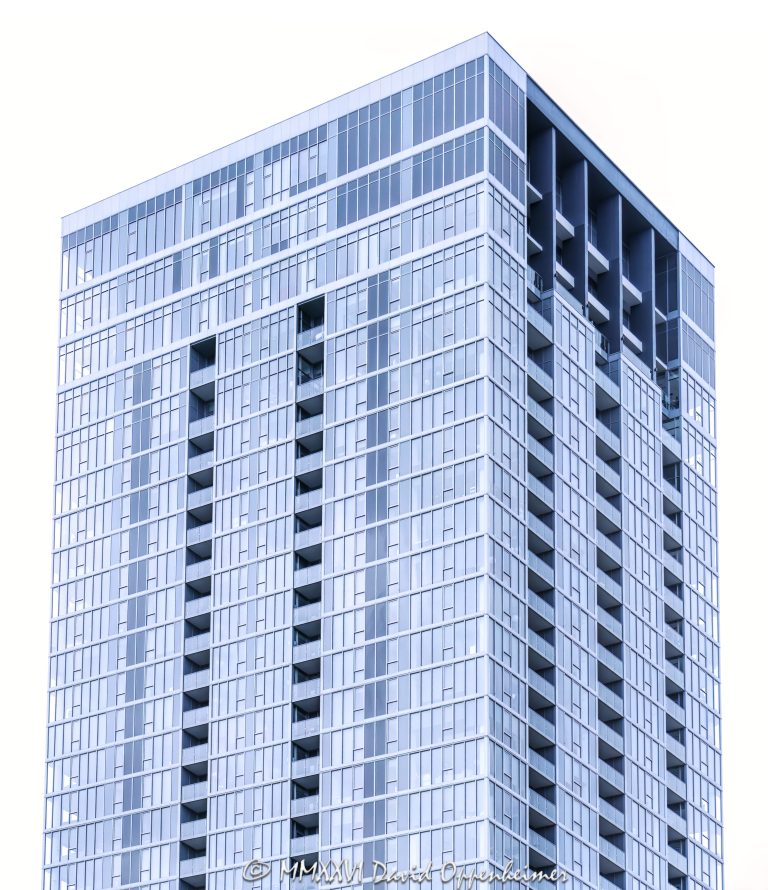 369 Grand by Onni rental apartment tower in Chicago, Illinois, located at 369 West Grand Avenue in the River North neighborhood. Contemporary residential high-rise architecture featuring a glass-clad tower, recessed balconies, and a podium with retail space. The 41-story apartment building was developed by Onni Group and designed by Brininstool + Lynch, with luxury rental residences and amenity spaces in downtown Chicago – © 2026 David Oppenheimer – Performance Impressions photography archives https://performanceimpressions.com 369 Grand, 369 Grand by Onni, 369 West Grand, 369 West Grand Avenue, 369 W Grand, West Grand Avenue, Grand Avenue, Onni Group, Onni, Chicago, Chicago Illinois, Illinois, United States, 60654, Downtown Chicago, River North, Chicago Loop, architecture, Chicago architecture, architectural photography, urban architecture, modern architecture, contemporary architecture, residential architecture, apartment tower, apartment building, rental apartments, luxury apartments, residential tower, residential building, high-rise, skyscraper, building, tower, glass tower, glass building, glass facade, glass-clad tower, reflective glass, curtain wall, balconies, recessed balconies, facade, building exterior, podium, retail space, parking podium, amenity space, residential real estate, apartment real estate, Chicago real estate, real estate, downtown apartments, River North apartments, Chicago apartments, luxury rentals, urban living, city living, commercial architecture, downtown, urban, iconic building, American architecture, Illinois architecture, exterior, daylight, business district, financial district, Brininstool Lynch, Brininstool + Lynch, CMK Companies, commercial photography, commercial imagery, image licensing, licensing, photography licensing, David Oppenheimer, facade, vertical, 1-15156784411