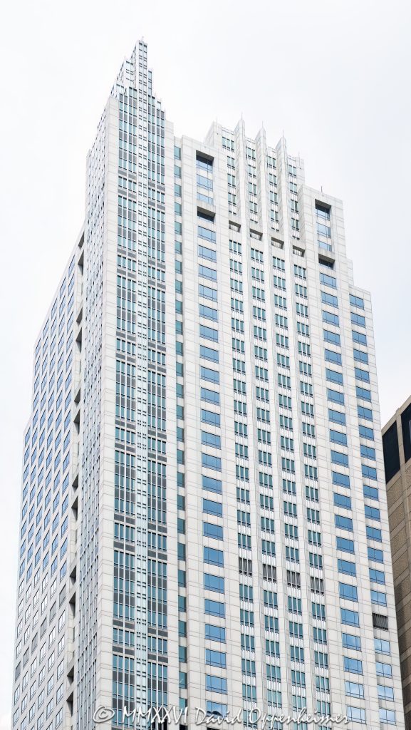 500 West Monroe office tower in Chicago, Illinois, located in the West Loop near Union Station and Ogilvie Transportation Center. Postmodern commercial skyscraper architecture designed by Skidmore, Owings & Merrill featuring a granite and glass exterior, stepped massing, reflective facade, and a distinctive turret-like crown. The 45-story office building was completed in 1992 and was formerly known as the Heller International Building – © 2026 David Oppenheimer – Performance Impressions photography archives https://performanceimpressions.com 500 West Monroe, 500 West Monroe Street, 500 W Monroe, West Monroe Street, Monroe Street, Heller International Building, Heller International Tower, Chicago, Chicago Illinois, Illinois, United States, 60661, Downtown Chicago, West Loop, Chicago Loop, Union Station, Ogilvie Transportation Center, architecture, Chicago architecture, architectural photography, facade, building exterior, exterior, postmodern architecture, modern architecture, contemporary architecture, postmodern skyscraper, skyscraper, high-rise, office tower, building, tower, office building, commercial building, corporate tower, corporate headquarters, commercial real estate, corporate real estate, real estate, business district, financial district, commercial architecture, corporate architecture, downtown, urban, glass tower, glass building, glass facade, reflective glass, granite facade, granite exterior, curtain wall, stepped tower, turret crown, illuminated crown, crown, iconic building, American architecture, Illinois architecture, daylight, financial center, business center, Class A office building, Chicago skyscraper, Chicago office tower, downtown office tower, commercial tower, office architecture, Loop district, West Loop architecture, Skidmore Owings Merrill, Skidmore Owings and Merrill, SOM, Tishman Speyer, Spear Street Capital, JLL, commercial photography, commercial imagery, image licensing, licensing, photography licensing, David Oppenheimer, vertical, 1-15156784411