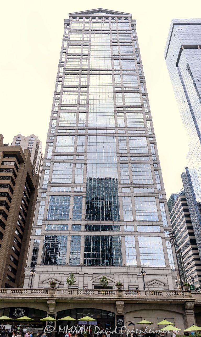 77 West Wacker Drive office tower in downtown Chicago, Illinois, located along the Chicago River in the Loop business district. Contemporary commercial skyscraper architecture featuring reflective glass design and prominent riverfront positioning. - © 2026 David Oppenheimer - Performance Impressions photography archives https://performanceimpressions.com 77 West Wacker, 77 West Wacker Drive, 77 W Wacker, West Wacker Drive, Wacker Drive, RR Donnelley Building, ADM Headquarters, Ricardo Bofill, Ricardo Bofill Architecture, Ricardo Bofill Taller de Arquitectura, United Building, Prime Group Realty Trust, Cohen-Barreto-Marchertas, Schal Associates, Chicago, Chicago Illinois, Illinois, Downtown Chicago, Chicago Loop, Chicago River, skyline, Chicago Skyline, cityscape, architecture, Chicago architecture, architectural photography, urban architecture, modern architecture, postmodern architecture, contemporary architecture, skyscraper, high-rise, office tower, building, tower, office building, commercial building, corporate tower, commercial real estate, corporate real estate, real estate, business district, financial district, commercial architecture, corporate architecture, downtown, urban, riverfront architecture, riverfront tower, glass tower, glass building, glass facade, facade, building exterior, reflections, river reflections, iconic building, landmark, American architecture, Illinois architecture, travel, tourism, destination, city life, metropolitan, urban skyline, exterior, daylight, waterfront, financial center, business center, United States, David Oppenheimer, color, vertical, 1-15156784411,