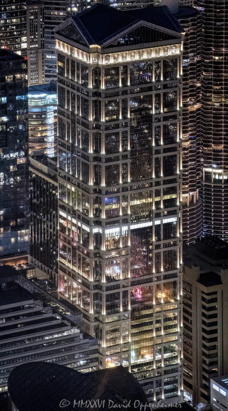 77 West Wacker Drive office tower in downtown Chicago, Illinois, located along the Chicago River in the Loop business district. Contemporary commercial skyscraper architecture featuring reflective glass design and prominent riverfront positioning. - © 2026 David Oppenheimer - Performance Impressions photography archives https://performanceimpressions.com 77 West Wacker, 77 West Wacker Drive, 77 W Wacker, West Wacker Drive, Wacker Drive, RR Donnelley Building, ADM Headquarters, Ricardo Bofill, Ricardo Bofill Architecture, Ricardo Bofill Taller de Arquitectura, United Building, Prime Group Realty Trust, Cohen-Barreto-Marchertas, Schal Associates, Chicago, Chicago Illinois, Illinois, Downtown Chicago, Chicago Loop, Chicago River, skyline, Chicago Skyline, cityscape, architecture, Chicago architecture, architectural photography, urban architecture, modern architecture, postmodern architecture, contemporary architecture, skyscraper, licensing, high-rise, office tower, building, tower, office building, commercial building, corporate tower, commercial real estate, corporate real estate, real estate, business district, financial district, commercial architecture, corporate architecture, downtown, urban, riverfront architecture, riverfront tower, glass tower, glass building, glass facade, facade, building exterior, reflections, river reflections, iconic building, landmark, American architecture, Illinois architecture, travel, tourism, destination, city life, metropolitan, urban skyline, exterior, daylight, waterfront, financial center, business center, United States, David Oppenheimer, color, vertical, 1-15156784411,