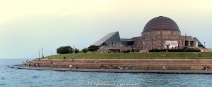Adler Planetarium and Skyline Walk on the Chicago Lakefront Adler Planetarium and Skyline Walk line Chicago’s Lake Michigan waterfront as people enjoy a summer afternoon along the curved shoreline, with the Art Deco planetarium and glass Sky Pavilion overlooking the water. Located at 1300 South DuSable Lake Shore Drive, the complex combines Ernest A. Grunsfeld Jr.’s original 1930 planetarium with the later pavilion by Lohan Associates – © 2026 David Oppenheimer – Performance Impressions photography archives https://performanceimpressions.com Adler Planetarium and Skyline Walk, Adler Planetarium Skyline Walk, Adler Planetarium, Adler Planetarium Chicago, Skyline Walk, Skyline Walk Chicago, Adler Skyline Walk, Adler Planetarium and Astronomy Museum, 1300 S DuSable Lake Shore Drive, 1300 South DuSable Lake Shore Drive, 1300 S Lake Shore Drive, 1300 South Lake Shore Drive, DuSable Lake Shore Drive, Lake Shore Drive, Museum Campus, Museum Campus Chicago, Northerly Island, Northerly Island Chicago, Northerly Island Park, Solidarity Drive, Near South Side, South Loop, South Loop Chicago, Chicago Illinois, Chicago IL, 60605, Lake Michigan, lake, water, lakefront, waterfront, shoreline, seawall, seawall seating, waterfront seating, lakefront seating, benches, outdoor benches, promenade, walkway, walking path, Lakefront Trail, Chicago Lakefront Trail, people, visitors, tourists, sightseeing, sitting, walking, recreation, outdoors, public space, Chicago lakefront, Chicago waterfront, Lake Michigan waterfront, planetarium, museum, astronomy museum, science museum, space museum, astronomy, science, space, education, attraction, Chicago attraction, tourist attraction, cultural attraction, Chicago museum, first planetarium, historic planetarium, facade, building exterior, exterior, museum exterior, Art Deco, Art Deco facade, granite facade, rainbow granite, copper dome, dome, historic facade, 12 sided building, Sky Pavilion, glass pavilion, curved glass, Doane Observatory, observatory, historic building, landmark building, National Historic Landmark, architecture, architectural photography, Chicago architecture, museum architecture, Art Deco architecture, historic architecture, Ernest A Grunsfeld Jr, Ernest Grunsfeld, Max Adler, Alfonso Iannelli, Lohan Associates, Chicago Park District, Illinois architecture, United States, licensing, image licensing, commercial imagery, photography licensing, art, print, fine art, commercial photography, David Oppenheimer, horizontal, 1-15213827141