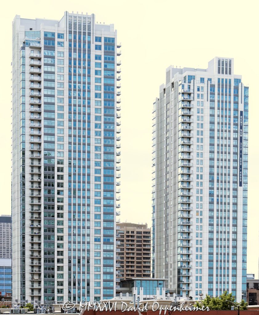 150 North Riverside Plaza oAlta at K Station apartment towers in Chicago, Illinois, located at 555 West Kinzie Street in the Fulton River District between River North and the West Loop. Contemporary residential high-rise architecture by Pappageorge Haymes Partners featuring two modern rental apartment towers, glass facade design, balconies, and downtown residential positioning near the Chicago River. The luxury apartment complex was developed by Fifield Companies and completed in 2010 – © 2026 David Oppenheimer – Performance Impressions photography archives https://performanceimpressions.com Alta Chicago, Alta at K Station, Alta Apartments, Alta apartment towers, Alta rental apartments, Alta Chicago apartments, 555 West Kinzie, 555 West Kinzie Street, 555 W Kinzie, West Kinzie Street, Kinzie Street, Chicago, Chicago Illinois, Illinois, United States, 60654, Downtown Chicago, Fulton River District, River North, West Loop, Chicago Loop, Chicago River, architecture, Chicago architecture, architectural photography, facade, building exterior, exterior, residential architecture, modern architecture, contemporary architecture, urban architecture, apartment tower, apartment building, rental apartments, luxury apartments, residential tower, residential building, two-tower complex, high-rise, skyscraper, building, tower, glass tower, glass building, glass facade, reflective glass, curtain wall, balconies, balcony, podium, retail space, residential real estate, apartment real estate, Chicago real estate, real estate, downtown apartments, River North apartments, West Loop apartments, Chicago apartments, luxury rentals, urban living, city living, mixed-use building, commercial architecture, downtown, urban, iconic building, American architecture, Illinois architecture, daylight, multifamily housing, Pappageorge Haymes Partners, Pappageorge Haymes, Fifield Companies, McHugh Construction, commercial photography, commercial imagery, image licensing, licensing, photography licensing, David Oppenheimer, vertical, 1-15156784411