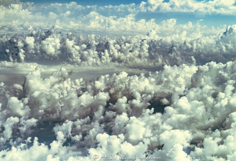 Altocumulus castellanus clouds seen from altitude in a scenic aerial view, with silver linings and dramatic light patterns forming towering structures across the sky. The perspective highlights the grandeur and beauty of these rare cloud formations. - © 2025 David Oppenheimer - Performance Impressions aerial photography archives - https://performanceimpressions.com Altocumulus castellanus, Altocumulus, castellanus, aerial, aerial view, aerial photography, aerial photo, aerial photographer, photographer, clouds, cloudscape, altitude, sky, dramatic clouds, silver linings, scenic sky, weather, meteorology, atmosphere, formation, horizon, landscape, nature, majestic, monumental, ethereal, breathtaking, awe, wonder, surreal, dramatic light, atmospheric, moody sky, daytime sky, high altitude, photography, United States, horizontal, color, 1-14993092111