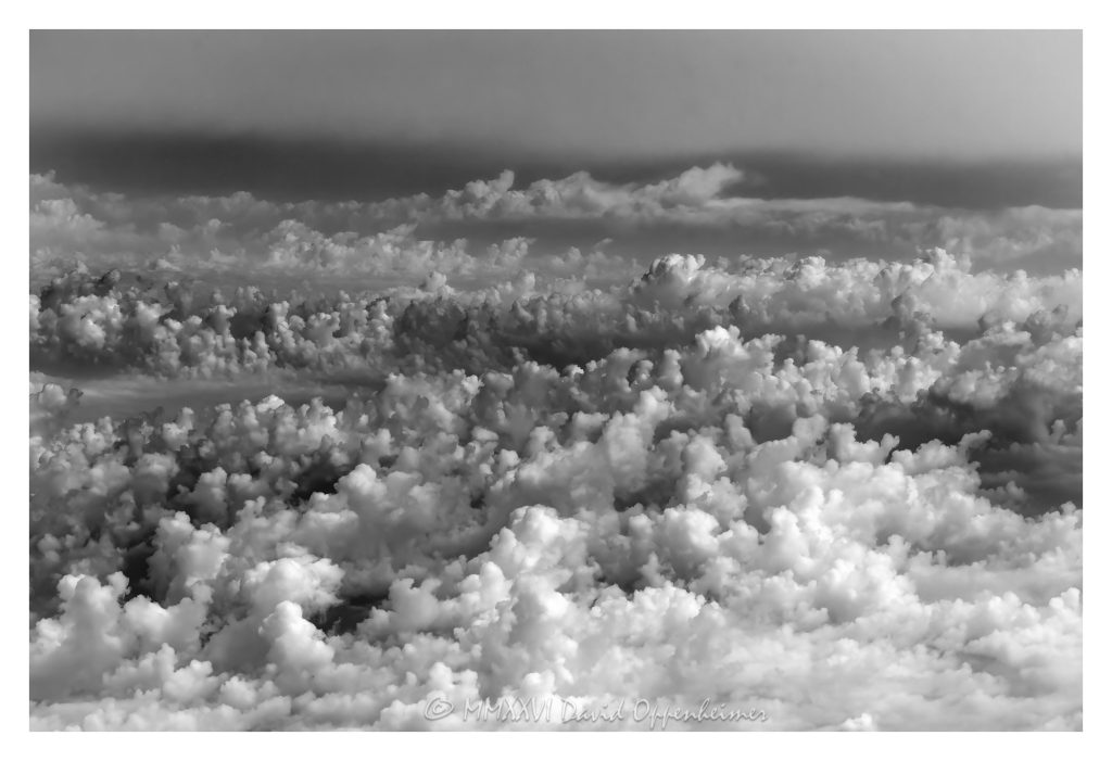 Altocumulus Castellanus Clouds Aerial View Altocumulus castellanus clouds seen from altitude in a scenic aerial view, with silver linings and dramatic light patterns forming towering structures across the sky. The perspective highlights the grandeur and beauty of these rare cloud formations. - © 2026 David Oppenheimer - Performance Impressions aerial photography archives - https://performanceimpressions.com Altocumulus castellanus, Altocumulus, castellanus, aerial, black and white, clouds, cloudscape, aerial view, aerial photography, aerial photo, aerial photographer, fine art, art, photographer, altitude, sky, dramatic clouds, silver linings, weather, meteorology, atmosphere, formation, horizon, landscape, nature, majestic, monumental, ethereal, breathtaking, awe, wonder, surreal, dramatic light, atmospheric, moody sky, daytime sky, billowing, towering, high altitude, photography, United States, horizontal, in the clouds, fine art photography, fine art photographer, David Oppenheimer, window seat, wall art, 1-14993092111