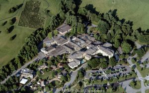 Antler Hill Village with the Village Hotel and Biltmore Estate Winery at the Biltmore Estate in Asheville, North Carolina aerial view - © 2024 David Oppenheimer - Performance Impressions aerial photography archives - https://performanceimpress ions.com Village Hotel on Biltmore Estate, Village Hotel, hotel, Biltmore Estate Winery, winery, aerial, Antler Hill Village, Antler Hill, Biltmore Estate, Biltmore House, Biltmore, Biltmore House aerial, Asheville, Biltmore aerial, Biltmore Estate aerial, Buncombe County, North Carolina, aerial, Asheville aerial, WNC, AVL, city, City of Asheville, George Washington Vanderbilt II, George Vanderbilt, photo, photography, United States, horizontal, color, David Oppenheimer, David Gordon Oppenheimer, Bistro, parking lot, parking, 1-13726821381