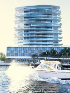 AquaBlu waterfront condos at 920 Intracoastal Dr in Fort Lauderdale Historic District in Florida - © 2024 David Oppenheimer - Performance Impressions photography archives - https://performanceimpressions.com AquaBlu, AquaBlu condos, 920 Intracoastal Dr, Historic District, boat, boating, yachting, splash, waves, water, condo building, building, condos, apartments, Fort Lauderdale, Florida, facade, waterfront, luxury real estate, real estate, Fort Lauderdale real estate, dock, dockage, home, Intracoastal, Intracoastal Waterway, gated community, community, private community, private, prestigious, balcony, balconies, windows, luxury rental, rental, 33304, South Florida, Broward County, neighborhood, security, Ocean Land Investments, apartment building, contemporary, modern, exclusive, property, peninsula, luxury condos, smart home, resort-style, outdoor living, New River, East Fort Lauderdale, architecture, sunset, palm trees, seawall, tropical, David Oppenheimer, color, vertical, United States, VAu 1-530-124, 1-13553735171,