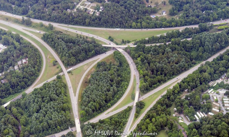 Aerial view of the Interstate 26 and Interstate 40 interchange in Asheville, North Carolina, including I-26, I-40, and I-240 highway infrastructure, ramps, traffic patterns, and road network in Buncombe County, before major reconstruction associated with the Asheville I-26 Connector project – © 2026 David Oppenheimer – Performance Impressions photography archives https://performanceimpressions.com Interstate 26, Interstate 40, I-26, I-40, I-240, Interstate 240, I-26 I-40 interchange, Interstate 26 interchange, Interstate 40 interchange, Asheville I-26 Connector, I-26 Connector project, I-26 Connector, highway interchange, freeway interchange, road interchange, Asheville, Asheville North Carolina, Asheville NC, North Carolina, NC, United States, Buncombe County, Western North Carolina, aerial, aerial photo, aerial photograph, aerial photography, aerial photographer, aerial view, aerial image, aerial perspective, aerial landscape, transportation, transportation infrastructure, highway, freeway, interstate highway, road, roadway, roads, traffic, traffic pattern, ramps, exit ramp, entrance ramp, overpass, bridge, highway ramp, road network, road system, urban planning, civil engineering, infrastructure, transportation engineering, highway construction, reconstruction, highway project, road construction, city from above, American highway, American infrastructure, road photography, documentary photography, editorial photography, commercial photography, commercial imagery, image licensing, licensing, photography licensing, David Oppenheimer, 1-15156784411