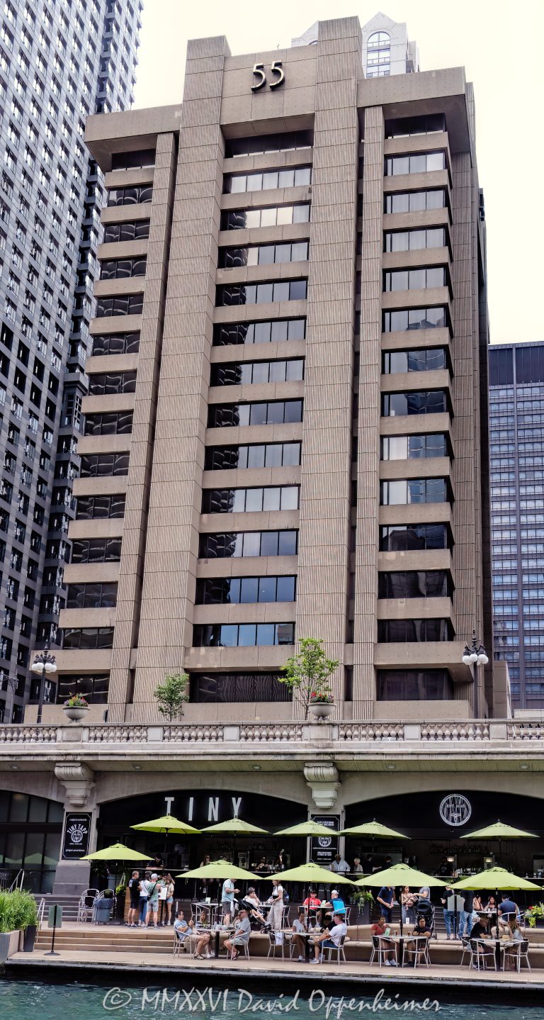 55 West Wacker office building in Chicago, Illinois, located along the Chicago River in the Loop business district. Brutalist commercial architecture designed by C.F. Murphy Associates featuring a concrete facade, deep-set windows, and a strong riverfront office presence near Wacker Drive and Dearborn Street. Built in 1968 as the Blue Cross Blue Shield of Illinois headquarters, the 16-story building is also historically known as the Blue Cross-Blue Shield Building – © 2026 David Oppenheimer – Performance Impressions photography archives https://performanceimpressions.com 55 West Wacker, 55 West Wacker Drive, 55 W Wacker, West Wacker Drive, Wacker Drive, Blue Cross-Blue Shield Building, Blue Cross Blue Shield Building, former Blue Cross Blue Shield headquarters, Blue Cross Blue Shield of Illinois, Chicago, Chicago Illinois, Illinois, United States, 60601, Downtown Chicago, Chicago Loop, Chicago River, Chicago riverfront, architecture, Chicago architecture, architectural photography, facade, building exterior, exterior, Brutalist architecture, brutalism, concrete facade, concrete building, concrete tower, deep-set windows, recessed windows, modern architecture, commercial architecture, office architecture, office tower, office building, commercial building, building, tower, high-rise, commercial real estate, corporate real estate, real estate, business district, financial district, corporate architecture, downtown, urban, riverfront architecture, riverfront building, riverfront office building, iconic building, American architecture, Illinois architecture, daylight, waterfront, financial center, business center, Class A office building, Chicago office tower, downtown office tower, C.F. Murphy Associates, CF Murphy Associates, C F Murphy Associates, Pearl Properties, Taipei Economic and Cultural Office, TECO Chicago, commercial photography, commercial imagery, image licensing, licensing, photography licensing, David Oppenheimer, vertical, 1-15156784411