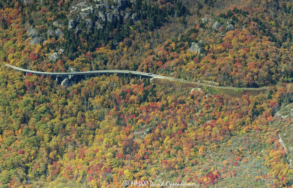 Linn Cove Viaduct on the Blue Ridge Parkway at the Base of Grandfather Mountain with Peak Autumn Colors Aerial View