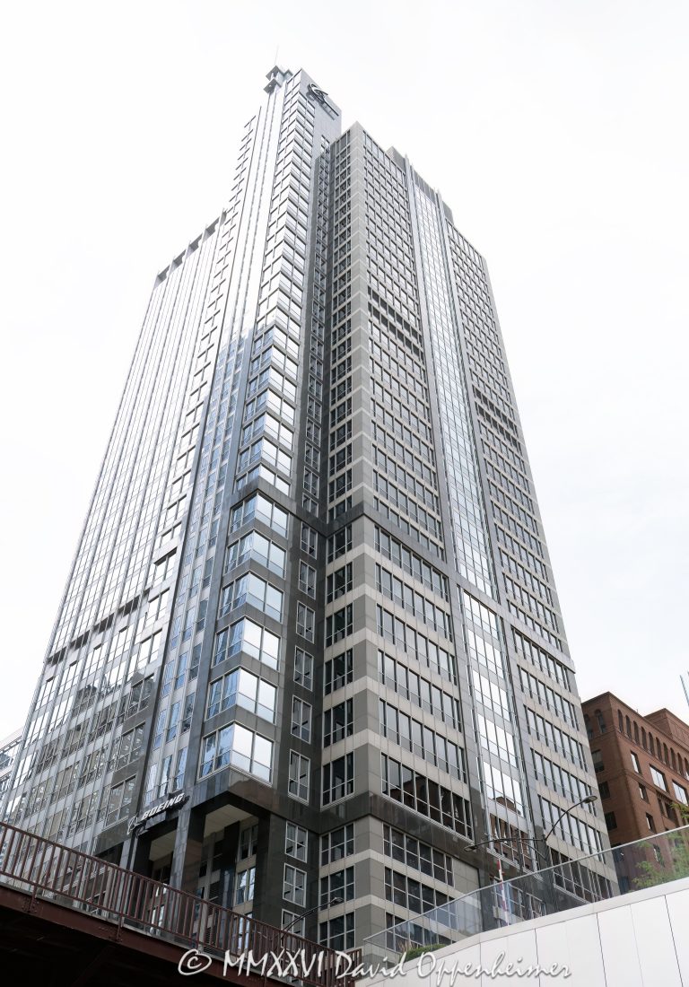Boeing Building at 100 North Riverside Plaza in Chicago, Illinois, located on the west side of the Chicago River across from the Loop. Postmodern commercial office architecture designed by Perkins and Will featuring a granite and glass facade, vertical setbacks, and a structural system that spans over active railroad tracks near Union Station. The 36-story office building was completed in 1990, was originally known as the Morton-Thiokol International Building, and later served as Boeing’s Chicago headquarters – © 2026 David Oppenheimer – Performance Impressions photography archives https://performanceimpressions.com Boeing Building, Boeing Building Chicago, Boeing International Headquarters, Boeing headquarters, former Boeing headquarters, Boeing Chicago, The Boeing Company, Boeing, 100 North Riverside Plaza, 100 N Riverside Plaza, North Riverside Plaza, Riverside Plaza, Morton-Thiokol International Building, Morton Thiokol Building, Morton Salt, Chicago, Chicago Illinois, Illinois, United States, 60606, Downtown Chicago, Chicago Loop, Chicago River, Chicago riverfront, West Loop, Near West Side, Union Station, Chicago Union Station, architecture, Chicago architecture, architectural photography, facade, building exterior, exterior, postmodern architecture, modern architecture, commercial architecture, corporate architecture, office architecture, office tower, office building, commercial building, corporate tower, corporate headquarters, commercial real estate, corporate real estate, real estate, business district, financial district, downtown, urban, high-rise, skyscraper, building, tower, granite facade, granite exterior, glass facade, reflective glass, curtain wall, vertical setbacks, setback tower, steel trusses, structural system, railroad tracks, rail tracks, air rights, iconic building, American architecture, Illinois architecture, daylight, waterfront, financial center, business center, Class A office building, Chicago skyscraper, Chicago office tower, downtown office tower, commercial tower, Perkins and Will, Perkins+Will, Ralph Johnson, Rubloff, Orient Leasing, commercial photography, commercial imagery, image licensing, licensing, photography licensing, David Oppenheimer, vertical, 1-15156784411