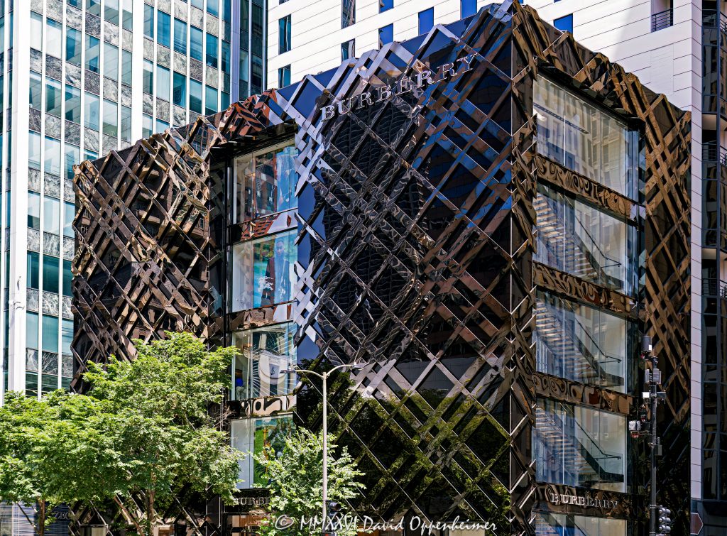 Burberry Michigan Avenue store at 633 North Michigan Avenue in Chicago features a black stainless-steel and fritted-glass facade patterned after the British luxury brand’s signature check. Designed by Callison Barteluce with Solomon Cordwell Buenz as architect of record, the flagship retail building stands at Michigan Avenue and Ontario Street on the Magnificent Mile – © 2026 David Oppenheimer – Performance Impressions photography archives https://performanceimpressions.com Burberry, Burberry Michigan Avenue, Burberry Michigan Avenue Chicago, Burberry Chicago, Burberry store Chicago, Burberry Chicago store, Burberry flagship store, Burberry Chicago flagship, Burberry Michigan Avenue store, Burberry 633 Michigan, 633 North Michigan Avenue, 633 N Michigan Avenue, 633 N Michigan Ave, 633 North Michigan, 633 N Michigan, North Michigan Avenue, Michigan Avenue, East Ontario Street, Ontario Street, Magnificent Mile, Mag Mile, Streeterville, Streeterville Chicago, Near North Side, downtown Chicago, Chicago, Chicago Illinois, Chicago IL, Illinois, 60611, facade, building exterior, exterior, retail facade, storefront, store exterior, Chicago storefront, black facade, stainless steel facade, black stainless steel, polished stainless steel, metal facade, fritted glass, black glass, glass facade, glass wall, curtain wall, check facade, check pattern, Burberry check, Burberry plaid, tartan pattern, plaid pattern, geometric facade, sculptural facade, glass and metal, architectural branding, brand architecture, facade design, signage, Burberry sign, building, retail building, commercial building, store, boutique, flagship store, luxury boutique, fashion boutique, retail store, luxury retail, designer retail, fashion store, luxury shopping, Chicago shopping, Michigan Avenue shopping, Magnificent Mile shopping, shopping, retail, fashion, luxury fashion, designer fashion, British fashion, British luxury, luxury brand, British fashion house, womenswear, menswear, childrenswear, outerwear, trench coat, Burberry trench coat, accessories, real estate, Chicago real estate, commercial real estate, retail real estate, Magnificent Mile real estate, architecture, architectural photography, storefront photography, retail photography, Chicago architecture, retail architecture, commercial architecture, contemporary architecture, modern architecture, Callison Barteluce, Callison Barteluce Architects, Solomon Cordwell Buenz, SCB, Christopher Bailey, Heintges Associates, Zahner, A Zahner Company, Shawmut, Power Construction, Burberry Limited, Burberry Group, Burberry Group plc, Thomas Burberry, Illinois architecture, United States, licensing, image licensing, commercial imagery, photography licensing, art, print, fine art, commercial photography, David Oppenheimer, horizontal, 1-15213827141
