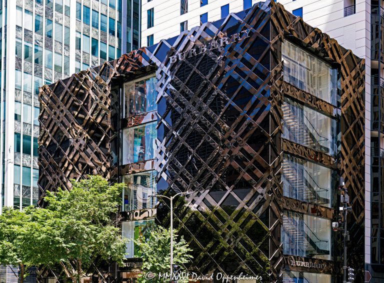 Burberry Michigan Avenue store at 633 North Michigan Avenue in Chicago features a black stainless-steel and fritted-glass facade patterned after the British luxury brand’s signature check. Designed by Callison Barteluce with Solomon Cordwell Buenz as architect of record, the flagship retail building stands at Michigan Avenue and Ontario Street on the Magnificent Mile – © 2026 David Oppenheimer – Performance Impressions photography archives https://performanceimpressions.com Burberry, Burberry Michigan Avenue, Burberry Michigan Avenue Chicago, Burberry Chicago, Burberry store Chicago, Burberry Chicago store, Burberry flagship store, Burberry Chicago flagship, Burberry Michigan Avenue store, Burberry 633 Michigan, 633 North Michigan Avenue, 633 N Michigan Avenue, 633 N Michigan Ave, 633 North Michigan, 633 N Michigan, North Michigan Avenue, Michigan Avenue, East Ontario Street, Ontario Street, Magnificent Mile, Mag Mile, Streeterville, Streeterville Chicago, Near North Side, downtown Chicago, Chicago, Chicago Illinois, Chicago IL, Illinois, 60611, facade, building exterior, exterior, retail facade, storefront, store exterior, Chicago storefront, black facade, stainless steel facade, black stainless steel, polished stainless steel, metal facade, fritted glass, black glass, glass facade, glass wall, curtain wall, check facade, check pattern, Burberry check, Burberry plaid, tartan pattern, plaid pattern, geometric facade, sculptural facade, glass and metal, architectural branding, brand architecture, facade design, signage, Burberry sign, building, retail building, commercial building, store, boutique, flagship store, luxury boutique, fashion boutique, retail store, luxury retail, designer retail, fashion store, luxury shopping, Chicago shopping, Michigan Avenue shopping, Magnificent Mile shopping, shopping, retail, fashion, luxury fashion, designer fashion, British fashion, British luxury, luxury brand, British fashion house, womenswear, menswear, childrenswear, outerwear, trench coat, Burberry trench coat, accessories, real estate, Chicago real estate, commercial real estate, retail real estate, Magnificent Mile real estate, architecture, architectural photography, storefront photography, retail photography, Chicago architecture, retail architecture, commercial architecture, contemporary architecture, modern architecture, Callison Barteluce, Callison Barteluce Architects, Solomon Cordwell Buenz, SCB, Christopher Bailey, Heintges Associates, Zahner, A Zahner Company, Shawmut, Power Construction, Burberry Limited, Burberry Group, Burberry Group plc, Thomas Burberry, Illinois architecture, United States, licensing, image licensing, commercial imagery, photography licensing, art, print, fine art, commercial photography, David Oppenheimer, horizontal, 1-15213827141