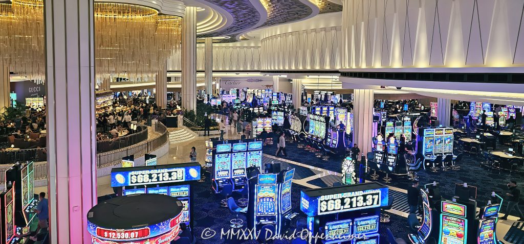 Fontainebleau Las Vegas Bleau Bar and Casino Fontainebleau Las Vegas Bleau Bar and casino floor in Las Vegas, Nevada - © 2025 David Oppenheimer - Performance Impressions travel photography archives - https://performanceimpressions.com casino, casino floor, Bleau Bar, chandelier, Fontainebleau Las Vegas, Fontainebleau, bar, slot machines, slots, floor, games, drinks, cocktails, drinking, lighting, Nevada, design, lights, crystal, crystal chandelier, Morris Lapidus, resort, Vegas, art deco, Fontainebleau Development, bowties, nightlife, Jeffrey Soffer, Carlos Zapata Studio, Bowtie Hospitality, bowtie, hospitality, Maurice Wooden, Koch Real Estate Investments, Las Vegas, money, betting, gaming, play, odds, win, gambling, wager, bet, luck, gamble, 2777 South Las Vegas Boulevard, 89109, interior design, architecture, decor, luxury resort, VIP, mixology, sparkle, shimmer, opulent, reflective, vacation, resort photography, resort photographer, real estate, luxury bar, United States, vertical, color, 1-14993092111