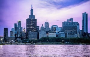 South Loop Chicago Skyline Beyond Grant Park at Blue Hour Chicago’s South Loop skyline rises beyond Grant Park at blue hour, with Buckingham Fountain and Queen’s Landing visible along the Lake Michigan waterfront beneath a violet evening sky. The lake reflects the fading post-sunset light as downtown office, residential, hotel, and cultural towers extend across the horizon in Chicago, Illinois – © 2026 David Oppenheimer – Performance Impressions photography archives https://performanceimpressions.com Chicago skyline, Chicago cityscape, Grant Park skyline, Chicago blue hour, Lake Michigan, Buckingham Fountain, Clarence Buckingham Fountain, Clarence F Buckingham Memorial Fountain, Queen’s Landing, Queens Landing, Grant Park, Chicago lakefront, Chicago waterfront, South Loop skyline, downtown Chicago, Chicago Loop, Loop Chicago, South Loop, West Loop, Financial District, Michigan Avenue, South Michigan Avenue, Chicago, Chicago Illinois, Chicago IL, Illinois, 60601, 60603, 60604, 60605, skyline, cityscape, landscape, urban landscape, blue hour, twilight, dusk, after sunset, evening, evening light, purple sky, violet sky, lake reflection, reflections, clouds, cloudscape, horizon, lake, water, lakefront, waterfront, shoreline, architecture, buildings, skyscrapers, towers, high rise, office towers, residential towers, hotel towers, real estate, Chicago real estate, South Loop real estate, commercial real estate, office real estate, residential real estate, Roosevelt University Wabash Building, Wabash Building, Roosevelt University, 425 S Wabash Ave, 425 South Financial Place, One Financial Place, Four40, 440 S LaSalle St, Chicago Stock Exchange, Peoples Gas Building, Peoples Gas Light and Coke Building, 122 S Michigan Ave, Metropolitan Tower, Straus Building, Britannica Building, Beehive Building, 310 S Michigan Ave, Symphony Center, Orchestra Hall, Chicago Symphony Orchestra, 220 S Michigan Ave, Railway Exchange Building, Santa Fe Building, Motorola Building, Motorola, Motorola Solutions, 224 S Michigan Ave, Chapin and Gore Building, 63 E Adams St, MacLean Center, Illinois Athletic Club, SAIC, 112 S Michigan Ave, Palmer House a Hilton Hotel, Palmer House Hilton, Hilton, 17 E Monroe St, Citadel Center, Dearborn Center, 131 S Dearborn St, The Franklin, Franklin Center, AT&T Corporate Center, 227 W Monroe St, Chicago Board of Trade Building, CBOT Building, 141 W Jackson Blvd, The Legacy at Millennium Park, Legacy Tower, 60 E Monroe St, Daniel Burnham, Skidmore Owings Merrill, SOM, Graham Anderson Probst White, Ricardo Bofill, Solomon Cordwell Buenz, Chicago skyline art, Chicago cityscape art, Chicago art, skyline photography, cityscape photography, landscape photography, architectural photography, urban photography, artwork, wall art, art print, Chicago print, skyline print, United States, licensing, image licensing, commercial imagery, photography licensing, art, print, fine art, commercial photography, David Oppenheimer, horizontal, 1-15213827141