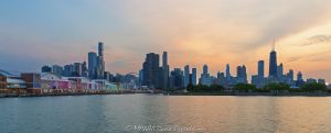 Navy Pier with Chicago Skyline at Sunset Navy Pier stretches across the foreground of a Lake Michigan view, with the Centennial Wheel, shops, restaurants, and lakefront attractions set against the Chicago skyline silhouetted at sunset. Designed by Charles S. Frost, the historic landmark in Chicago, Illinois, originally opened as Municipal Pier No. 2 – © 2026 David Oppenheimer – Performance Impressions photography archives https://performanceimpressions.com Navy Pier, Chicago skyline, Navy Pier Chicago, Centennial Wheel, Navy Pier Centennial Wheel, Centennial Ferris Wheel, Navy Pier Ferris wheel, Chicago Ferris wheel, Ferris wheel, observation wheel, Pier Park, gondolas, Chicago skyline sunset, Navy Pier sunset, Chicago Harbor, Lake Michigan, Chicago cityscape, Chicago sunset, Chicago lakefront, Chicago waterfront, 600 East Grand Avenue, 600 E Grand Ave, East Grand Avenue, Streeterville, Near North Side, downtown Chicago, Chicago, Chicago Illinois, Chicago IL, Illinois, 60611, skyline, cityscape, sunset, pier, lake, water, harbor, lakefront, waterfront, shoreline, horizon, silhouette, skyline silhouette, building silhouettes, sunset silhouette, evening, twilight, dusk, sunset sky, evening sky, golden light, city, urban, buildings, skyscrapers, towers, architecture, landscape, Municipal Pier No. 2, Municipal Pier 2, Municipal Pier, Charles Sumner Frost, Charles S Frost, Daniel Burnham, Plan of Chicago, historic pier, lakefront landmark, Chicago icon, waterfront architecture, historic architecture, tourism, travel, destination, recreation, entertainment, skyline photography, sunset photography, cityscape photography, landscape photography, architectural photography, Chicago art, ride, Wheel, skyline art, United States, licensing, image licensing, commercial imagery, photography licensing, art, print, fine art, commercial photography, David Oppenheimer, horizontal, 1-15213827141