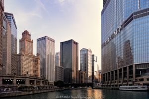 Chicago River Architecture and Skyline Chicago River architecture and skyline in late-day light, with downtown towers lining both banks as sunlight reflects from glass facades across the water. Viewed from a Chicago River architecture cruise, the scene includes the Riverwalk and a tour boat moving through the dense riverfront cityscape of Chicago, Illinois – © 2026 David Oppenheimer – Performance Impressions photography archives https://performanceimpressions.com Chicago River architecture, Chicago River skyline, Chicago architecture cruise, Chicago River cruise, Chicago River, Chicago Riverwalk, Riverwalk, Wacker Drive, Wacker Drive architecture, downtown Chicago, Chicago skyline, Chicago cityscape, River North, Chicago Loop, Loop Chicago, Chicago, Chicago Illinois, Chicago IL, Illinois, 60601, 60611, 35 West Wacker, 35 W Wacker Drive, Leo Burnett Building, Leo Burnett, 35 East Wacker, 35 E Wacker Drive, Jewelers Building, Pure Oil Building, North American Life Building, 77 West Wacker, 77 W Wacker Drive, RR Donnelley Building, United Building, OneEleven, One Eleven, 111 West Wacker, 111 W Wacker Drive, Waterview Tower, Trump International Hotel & Tower Chicago, Trump Tower Chicago, Trump Tower, 401 N Wabash Avenue, Wendella Linnea, Linnea, Wendella Boats, Richard J Cady Memorial River Lookout, river lookout, O'Brien's Riverwalk Cafe, riverwalk cafe, skyline, cityscape, architecture, river, water, riverfront, waterfront, downtown, urban, buildings, towers, skyscrapers, high rises, office towers, office buildings, commercial buildings, glass towers, facade, glass facade, reflective glass, sunlight, sun rays, late afternoon, golden hour, reflections, river reflection, sunlit buildings, urban canyon, river view, boat, riverboat, tour boat, boat tour, river cruise, architecture tour, architecture cruise, Chicago boat tour, tourism, travel, destination, Chicago photography, skyline photography, cityscape photography, architectural photography, urban photography, Chicago art, skyline art, cityscape art, urban art, artwork, wall art, art print, Chicago print, real estate, Chicago real estate, commercial real estate, office real estate, riverfront real estate, Skidmore Owings Merrill, SOM, Adrian Smith, William F Baker, Roche Dinkeloo, Kevin Roche, Giaver & Dinkelberg, Ricardo Bofill, Handel Architects, Related Midwest, Publicis Groupe, Trump Organization, United States, licensing, image licensing, commercial imagery, photography licensing, art, print, fine art, commercial photography, David Oppenheimer, horizontal, 1-15213827141