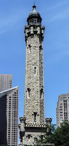 Historic Chicago Water Tower on Michigan Avenue Chicago Water Tower at 806 North Michigan Avenue in Chicago, Illinois, shown in a vertical daytime view emphasizing its limestone stonework, castellated Gothic Revival detailing, turrets, pointed arches, and tower profile. Designed by William W. Boyington to house a standpipe for the Chicago Avenue waterworks system, the landmark survived the Great Chicago Fire of 1871 and remains a defining structure on the Magnificent Mile – © 2026 David Oppenheimer – Performance Impressions photography archives https://performanceimpressions.com Chicago Water Tower, Historic Chicago Water Tower, Chicago Avenue Water Tower, Chicago Avenue Water Tower and Pumping Station, 806 North Michigan Avenue, 806 N Michigan Avenue, North Michigan Avenue, Michigan Avenue, Magnificent Mile, Mag Mile, Near North Side, Streeterville, Jane M Byrne Plaza, Chicago, Chicago Illinois, Chicago IL, Illinois, 60611, facade, building exterior, exterior, tower exterior, stone facade, limestone facade, stonework, masonry, limestone, Joliet limestone, Lemont limestone, Gothic Revival, Gothic Revival architecture, castellated Gothic, historic architecture, landmark architecture, Chicago architecture, vertical architecture, architecture, architectural photography, tower, water tower, historic tower, standpipe, standpipe tower, waterworks, water supply, municipal infrastructure, infrastructure, Chicago Water Works, Chicago Avenue Pumping Station, City Gallery, City Gallery in the Historic Water Tower, Water Tower Place, Great Chicago Fire, fire survivor, Chicago history, historic landmark, Chicago Landmark, National Register of Historic Places, Old Chicago Water Tower District, American Water Landmark, William W Boyington, William Boyington, Ellis S Chesbrough, pointed arches, lancet windows, crenellations, battlements, turrets, spire, buttresses, parapet, ornate stone, daytime, daylight, tourism, travel, destination, landmark, historic, building, United States, licensing, image licensing, commercial imagery, photography licensing, art, print, fine art, commercial photography, David Oppenheimer, vertical, 1-15213827141