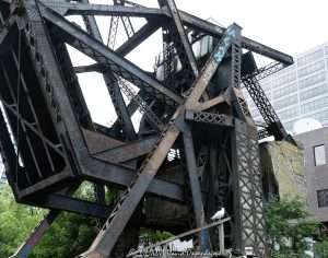 Chicago and North Western Railway Kinzie Street Bridge Raised Over Chicago River Chicago and North Western Railway Kinzie Street Bridge raised over the North Branch of the Chicago River in downtown Chicago, Illinois. Historic single-leaf bascule railroad bridge near Kinzie Street and Canal Street, also known as the Carroll Avenue Bridge, built in 1908 and designated a Chicago Landmark in 2007. The raised steel bridge is a former Chicago and North Western railroad span now owned by Union Pacific – © 2026 David Oppenheimer – Performance Impressions photography archives https://performanceimpressions.com Chicago and North Western Railway Bridge, Chicago & North Western Railway Bridge, Chicago and North Western Railroad Bridge, Chicago & North Western Railroad Bridge, Kinzie Street railroad bridge, Kinzie Street Railroad Bridge, Kinzie Street Bridge, Carroll Avenue Bridge, C&NW bridge, C&NW railroad bridge, Union Pacific bridge, Union Pacific Railroad, raised bridge, bridge, raised railroad bridge, open bridge, bascule bridge, single-leaf bascule bridge, railroad bridge, railway bridge, rail bridge, train bridge, steel bridge, steel girders, bridge girders, metal girders, steel truss, truss bridge, railroad truss, steel structure, bridge structure, riveted steel, steelwork, historic bridge, landmark bridge, Chicago Landmark, Chicago bridge, Chicago bridges, Chicago railroad bridge, Chicago railway bridge, Chicago River bridge, Chicago River, North Branch Chicago River, North Branch, Kinzie Street, Canal Street, Wolf Point, downtown Chicago, Chicago Loop, River North, Near West Side, Chicago, Chicago Illinois, Illinois, United States, 60654, architecture, Chicago architecture, architectural photography, bridge architecture, engineering, civil engineering, structural engineering, industrial architecture, transportation, transportation infrastructure, rail infrastructure, railroad infrastructure, railway infrastructure, railroad history, railway history, Chicago history, industrial history, historic infrastructure, urban infrastructure, bridge photography, railroad photography, rail photography, infrastructure photography, documentary photography, editorial photography, commercial photography, commercial imagery, image licensing, licensing, photography licensing, David Oppenheimer, horizontal, 1-15156784411
