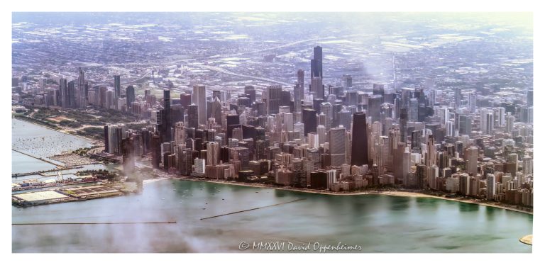 Chicago skyline and lakefront aerial photo over Lake Michigan in Chicago, Illinois, showing downtown Chicago, the Chicago Loop, Grant Park, Millennium Park, Navy Pier, Magnificent Mile, Streeterville, Gold Coast, and Oak Street Beach. Daytime perspective of the Chicago River, waterfront skyline, high-rise buildings, lakefront parks, and downtown neighborhoods extending across the Loop financial district, West Loop Gate, and Near North Side – © 2026 David Oppenheimer – Performance Impressions aerial photography archives https://performanceimpressions.com Chicago skyline, Chicago aerial, Chicago skyline aerial, aerial photo, aerial photography, aerial view, aerial, cityscape, Chicago cityscape, downtown Chicago, Chicago downtown, Chicago Loop, Loop, financial district, West Loop Gate, West Loop, Near North Side, Streeterville, Gold Coast, Magnificent Mile, Michigan Avenue, Grant Park, Millennium Park, Navy Pier, Oak Street Beach, Chicago River, Chicago Riverwalk, Lake Michigan, Chicago lakefront, lakefront, waterfront, waterfront skyline, urban skyline, skyline, skyscraper, skyscrapers, high-rise, building, tower, architecture, Chicago architecture, urban architecture, modern architecture, contemporary architecture, lakefront architecture, downtown skyline, city, urban, downtown, Chicago neighborhoods, downtown neighborhoods, lakefront parks, Grant Park aerial, Millennium Park aerial, Navy Pier aerial, Streeterville skyline, Gold Coast skyline, Loop skyline, West Loop skyline, River North, River North skyline, Lakeshore East, New Eastside, North Michigan Avenue, Near North Side skyline, Chicago high-rises, Chicago skyscrapers, office towers, residential towers, condo towers, hotel towers, glass towers, glass buildings, city from above, urban planning, city planning, travel photography, tourism, destination, Midwest city, Midwest skyline, Illinois, Chicago Illinois, United States, daylight, commercial photography, commercial imagery, image licensing, licensing, photography licensing, David Oppenheimer, horizontal, 1-15156784411