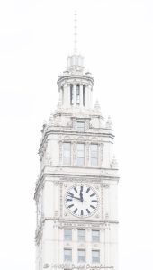 Wrigley Building Clock Tower on Michigan Avenue Chicago Wrigley Building clock tower at 400–410 North Michigan Avenue in Chicago, Illinois, located on the Magnificent Mile near the Chicago River. Historic terra cotta skyscraper architecture by Graham, Anderson, Probst & White featuring the building’s white clock tower, ornate facade, and landmark upper tower details. The clock reads 11:48 in this overcast close-up view of one of Chicago’s most recognizable buildings – © 2026 David Oppenheimer – Performance Impressions photography archives https://performanceimpressions.com Wrigley Building, Wrigley Building Chicago, Wrigley clock tower, Wrigley Building clock tower, clock tower, building clock, 400 North Michigan, 400 North Michigan Avenue, 410 North Michigan, 410 North Michigan Avenue, 400 N Michigan, 410 N Michigan, North Michigan Avenue, Michigan Avenue, Magnificent Mile, Chicago, Chicago Illinois, Illinois, United States, 60611, Downtown Chicago, Near North Side, Chicago Loop, Chicago River, architecture, Chicago architecture, architectural photography, facade, building exterior, exterior, historic architecture, terra cotta, white terra cotta, terra cotta facade, white facade, ornate facade, clock face, 11:48, tower detail, upper tower, landmark building, Chicago Landmark, historic building, skyscraper, high-rise, building, tower, office building, commercial building, commercial real estate, corporate real estate, real estate, Beaux-Arts architecture, Spanish Revival, French Renaissance, Graham Anderson Probst White, Graham Anderson Probst and White, GAPW, William Wrigley Jr, Wrigley Company, chewing gum company, Tribune Tower, DuSable Bridge, Michigan Avenue Bridge, white building, overcast, cloudy sky, soft light, daylight, urban architecture, American architecture, Illinois architecture, downtown, urban, tourism, travel, Chicago landmark, iconic building, commercial photography, commercial imagery, image licensing, licensing, photography licensing, art, print, fine art, David Oppenheimer, vertical, 1-15156784411