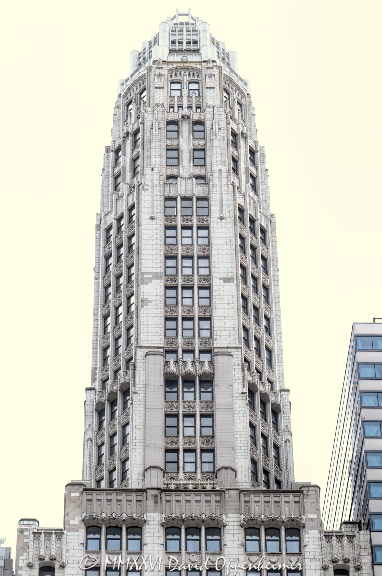 Club Quarters Hotel Wacker at Michigan at 75 East Upper Wacker Drive in Chicago, Illinois, occupies the historic Mather Tower, a slender Neo-Gothic terra-cotta high-rise overlooking the Chicago River. Designed by Herbert Hugh Riddle for Alonzo C. Mather, the landmark tower stands near Michigan Avenue, the Riverwalk, the Magnificent Mile, and the Chicago Loop – © 2026 David Oppenheimer – Performance Impressions photography archives https://performanceimpressions.com Club Quarters Hotel Wacker at Michigan, Club Quarters Hotel, Club Quarters Chicago, Club Quarters, CQ Hotels, CQ Hotel, Mather Tower, 75 East Upper Wacker Drive, 75 E Upper Wacker Drive, 75 East Wacker Drive, 75 E Wacker Drive, East Wacker Drive, Wacker Drive, Michigan Avenue, North Michigan Avenue, Chicago River, Chicago Riverwalk, Riverwalk, riverfront, downtown Chicago, Chicago Loop, Loop Chicago, Near North Side, River North, Magnificent Mile, Mag Mile, Chicago, Chicago Illinois, Chicago IL, Illinois, 60601, facade, building exterior, exterior, tower exterior, hotel exterior, terra cotta facade, terra cotta, Gothic terra cotta, Neo-Gothic, Neo-Gothic architecture, Gothic Revival, Modernistic skyscraper, Jazz Age architecture, historic architecture, Chicago architecture, high-rise architecture, architecture, architectural photography, hotel, hotel tower, riverfront hotel, downtown hotel, Chicago hotel, business hotel, business travel, hospitality, travel, tourism, destination, tower, skyscraper, high rise, slender tower, setback tower, landmark tower, historic tower, octagonal tower, cupola, vertical tower, city views, river views, Mather Stock Car Company, Alonzo C Mather, Herbert Hugh Riddle, W A Illsey, R F Wilson and Company, Overland Construction Company, Northwestern Terra Cotta, Chicago Landmark, Michigan Wacker Historic District, National Register of Historic Places, River Hotel, 75 East Wacker, real estate, hotel real estate, commercial real estate, Chicago real estate, United States, licensing, image licensing, commercial imagery, photography licensing, art, print, fine art, commercial photography, David Oppenheimer, vertical, 1-15213827141