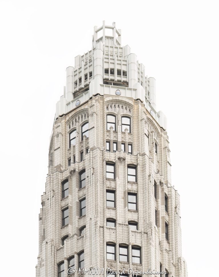 Club Quarters Hotel, Wacker at Michigan in Chicago, Illinois, located at 75 East Wacker Drive near Michigan Avenue, the Chicago River, and the Magnificent Mile. The hotel is housed in historic Mather Tower, a Neo-Gothic high-rise known for its slender white terra cotta tower and riverfront location. This vertical close-up shows the upper tower in soft overcast light, emphasizing the pale facade, historic detail, and light-box appearance of the building – © 2026 David Oppenheimer – Performance Impressions photography archives https://performanceimpressions.com Club Quarters Hotel, Club Quarters Chicago, Club Quarters Hotel Wacker at Michigan, Club Quarters Wacker at Michigan, CQ Hotels, Club Quarters, Mather Tower, Mather Tower Chicago, Lincoln Tower, 75 East Wacker, 75 East Wacker Drive, 75 E Wacker, East Wacker Drive, Wacker Drive, Michigan Avenue, Chicago River, Chicago Riverwalk, Magnificent Mile, Chicago, Chicago Illinois, Illinois, United States, 60601, Downtown Chicago, Chicago Loop, Loop, architecture, Chicago architecture, architectural photography, facade, building exterior, exterior, historic architecture, Neo-Gothic architecture, Gothic Revival, terra cotta, white terra cotta, terra cotta facade, white facade, pale facade, ornate facade, tower detail, upper tower, slender tower, high-rise, skyscraper, building, tower, hotel building, hotel architecture, hospitality architecture, boutique hotel, business hotel, riverfront hotel, downtown hotel, Chicago hotel, historic hotel, commercial architecture, commercial building, commercial real estate, hotel real estate, real estate, historic building, Chicago Landmark, landmark building, white building, overcast, cloudy sky, soft light, daylight, urban architecture, American architecture, Illinois architecture, downtown, urban, travel, tourism, commercial photography, commercial imagery, image licensing, licensing, photography licensing, art, print, fine art, David Oppenheimer, vertical, 1-15156784411
