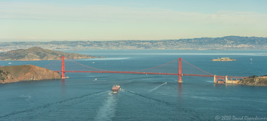 Container Ship Under the Golden Gate Bridge in San Francisco Aerial View