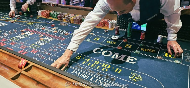 Craps table gambling at The Venetian casino in Las Vegas, Nevada - © 2025 David Oppenheimer - Performance Impressions travel photography archives - https://performanceimpressions.com The Venetian, casino, Las Vegas, craps, craps table, dice, chips, casino chips, money, roll of the dice, roll the dice, dice game, roll, table, gaming, play, Nevada, odds, win, gambling, wager, bet, luck, gamble, resort, 3355 S Las Vegas Blvd, 89109, United States, horizontal, color, 1-14977862771