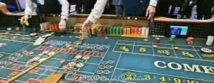 Craps table gambling at The Venetian casino in Las Vegas, Nevada - © 2025 David Oppenheimer - Performance Impressions travel photography archives - https://performanceimpressions.com The Venetian, casino, Las Vegas, craps, craps table, dice, chips, casino chips, money, roll of the dice, roll the dice, dice game, roll, table, gaming, play, Nevada, odds, win, gambling, wager, bet, luck, gamble, resort, 3355 S Las Vegas Blvd, 89109, United States, horizontal, color, 1-14977862771