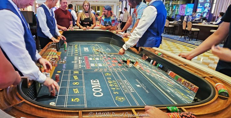 Craps table gambling at The Venetian casino in Las Vegas, Nevada - © 2025 David Oppenheimer - Performance Impressions travel photography archives - https://performanceimpressions.com The Venetian, casino, Las Vegas, craps, craps table, dice, chips, casino chips, money, roll of the dice, roll the dice, dice game, roll, table, gaming, play, Nevada, odds, win, gambling, wager, bet, luck, gamble, resort, 3355 S Las Vegas Blvd, 89109, United States, horizontal, color, 1-14977862771