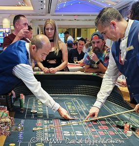 Craps table gambling at The Venetian casino in Las Vegas, Nevada - © 2025 David Oppenheimer - Performance Impressions travel photography archives - https://performanceimpressions.com The Venetian, casino, Las Vegas, craps, craps table, dice, chips, casino chips, money, roll of the dice, roll the dice, dice game, roll, table, gaming, play, Nevada, odds, win, gambling, wager, bet, luck, gamble, resort, 3355 S Las Vegas Blvd, 89109, United States, vertical, color, 1-14977862771