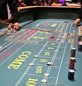 Craps table at Wynn Las Vegas Resort and Casino in Las Vegas, Nevada - © 2025 David Oppenheimer - Performance Impressions casino photography archives - https://performanceimpressions.com craps, craps table, Wynn Casino, casino, Wynn craps table, dice, chips, casino chips, gaming, play, betting, odds, win, gambling, wager, bet, luck, gamble, 3355 S Las Vegas Blvd, 89109, Wynn, Encore, Encore Las Vegas, Encore Resort, Encore Casino, Encore Vegas, Encore at Wynn, Wynn Las Vegas, Wynn Vegas, Wynn Resort, Wynn Resorts, 3131 Las Vegas Blvd S, 89109, hotel, resort, building, architecture, shops, shopping, bridge, night, lights, city lights, WYNN, WYNN stock, five star, luxury, Las Vegas, Vegas, Las Vegas Strip, table game, dice game, casino floor, entertainment, luxury gaming, Nevada casino, vacation, escape, dream, art, fine art, artwork, painting, Nevada, Nevada photography, colorful, wall art, United States, vertical, color, 1-14993092111